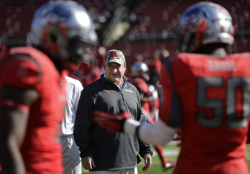 Rutgers defensive coordinator Dave Cohen watches his players warm up before an NCAA college football game against Cincinnati in Piscataway, N.J., on Saturday. A player who left the team says Cohen used two profane terms in the study hall in front of teammates and an academic adviser, who reported the issue, according to the website NJ.com.