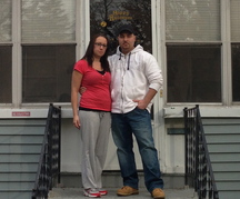 Teresa and Dan Reynolds stand in front of their Niagara Falls, N.Y., house in the neighborhood once known as Love Canal.