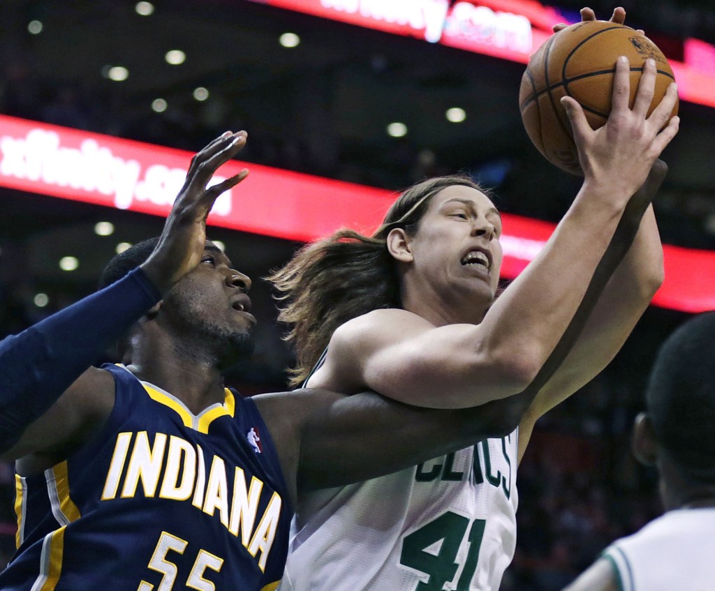 Boston Celtics center Kelly Olynyk battles for a rebound with Indiana Pacers center Roy Hibbert during Friday night’s game won by the Pacers.