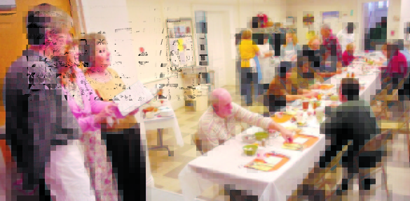 DINNER MUSIC: Jan Corcoran, left, Brin Amberlee, and Connie Hanson sing a hymn during a recent Thanksgiving dinner at the Green Street United Methodist Church in Augusta.