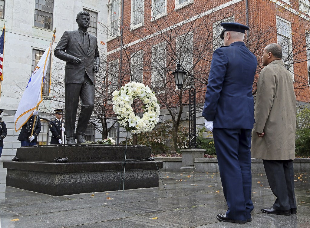 Gov. Deval Patrick, right, and L. Scott Rice, Adjutant General of the Massachusetts National Guard, lay a wreath at the State House statue of President John F. Kennedy, Friday, Nov. 22, 2013, in Boston. Kennedy, the 35th President of the United States, was assassinated in Dallas 50 years ago today.
