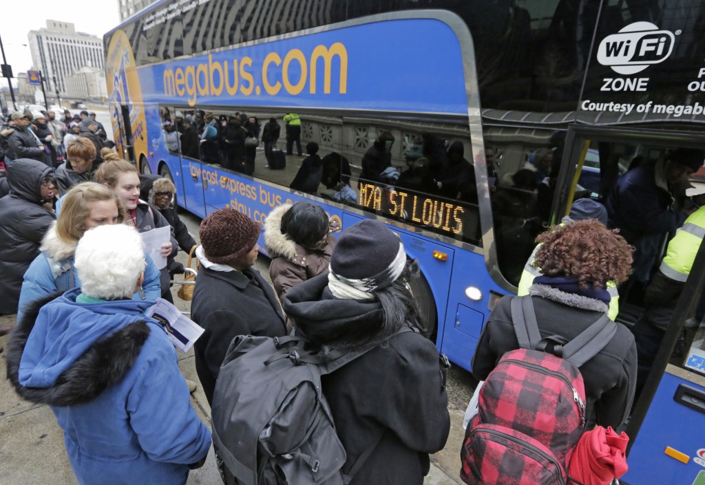Passengers board a Megabus headed to St. Louis and Memphis on Tuesday in Chicago. The nation’s bus industry has seen a drastic upgrade in recent years.