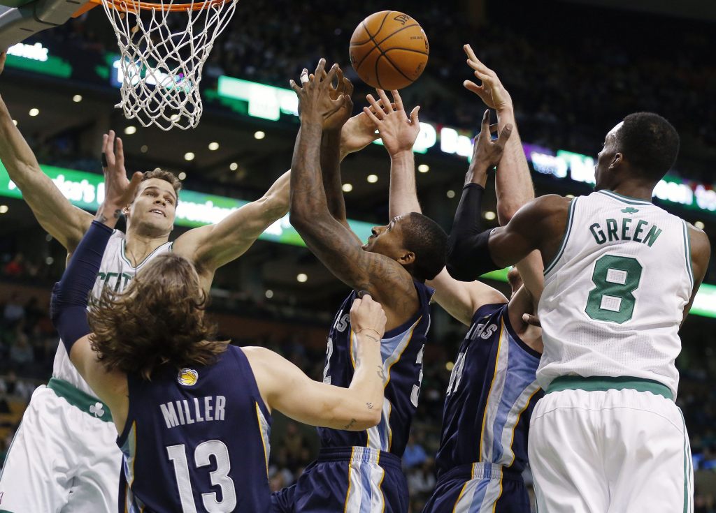 Boston Celtics’ Kris Humphries, left, and Jeff Green (8) battle for a rebound with Memphis Grizzlies’ Mike Miller (13), Ed Davis, center, and Kosta Koufos, second from right, in the first quarter o in Boston on Wednesday.