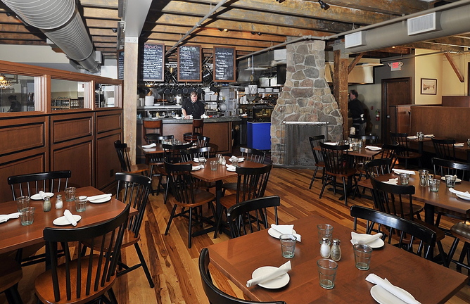 This Sept. 19, 2013 file photo shows the main dining room at Boone’s Fish House & Oyster Room on the Portland waterfront, where a fire started early this morning in the fireplace, damaging floorboards and causing the restaurant to be closed temporarily.