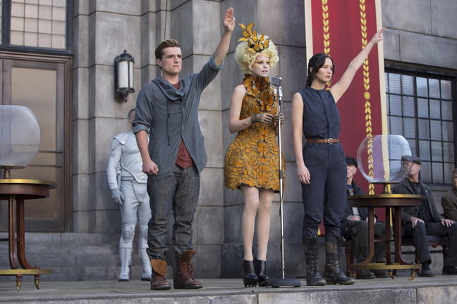 Josh Hutcherson as Peeta Mellark, from left, Elizabeth Banks as Effie Trinket and Jennifer Lawrence as Katniss Everdeen in a scene from "The Hunger Games: Catching Fire."