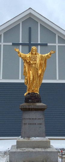The gold statue of Jesus Christ is back in Jackman after being vandalized in 2010 and repaired. It stands in front of the new St. Faustina Catholic Church.