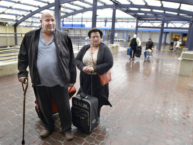 John Patriquin/Staff Photographer Carl Fecteau traveled from Louisville to Portland and described his flight as the most bumpy in all his years of travel. He was met by Sonia Gagnon of Portland.