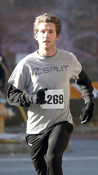 Wade Meddles, 21, of Richmond, Ky., runs to the finish to become the overall winner of the 4-mile race in 20 minutes, 53 seconds.