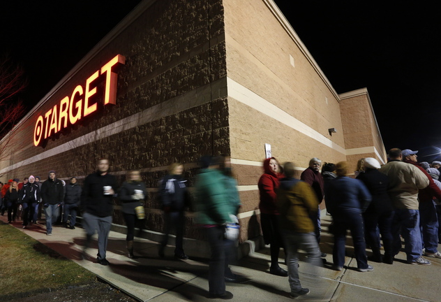 Black Friday shoppers move up a few spaces in a line that wrapped around Target in South Portland shortly before the store opened at midnight on Friday.