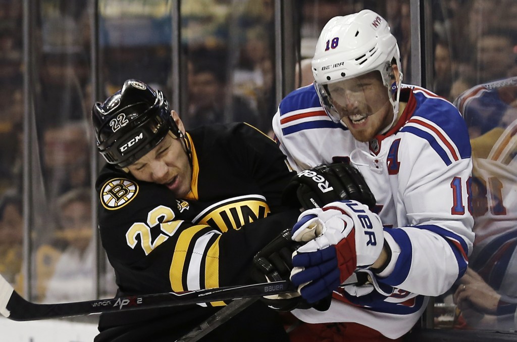 Shawn Thornton of the Boston Bruins checks Marc Staal of the New York Rangers during the second period of the Bruins' 3-2 victory at home Friday.