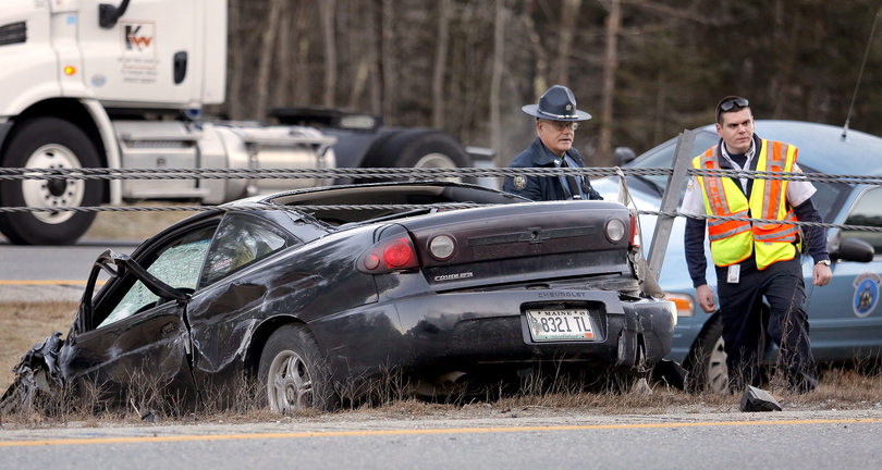 Emergency workers respond to a single-vehicle accident on Interstate 295 in Cumberland on Friday.