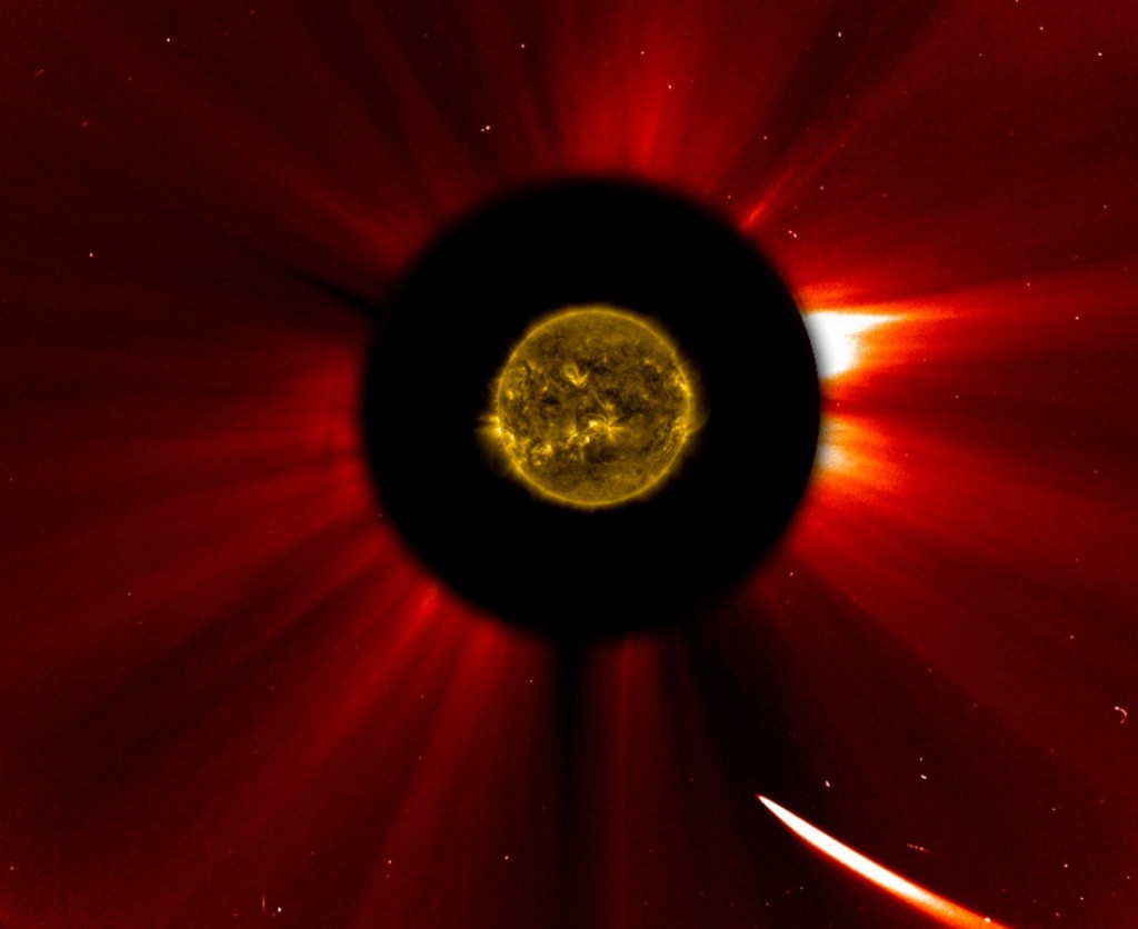 In a composite image provided by NASA, Comet ISON nears the sun in an image captured at 10:51 a.m. Eastern Standard Time on Thursday, Nov. 28, 2013. The sun was imaged by NASA's Solar Dynamics Observatory, and an image from ESA/NASA's Solar and Heliospheric Observatory shows the solar atmosphere, the corona. Scientists are studying spacecraft images to find out whether a small part ISON survived its close encounter with the sun. (AP Photo/ESA&NASA SOHO/SDO)