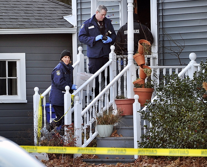 Evidence technicians enter the Westbrook apartment at 318A Main St., where state police were investigating an apparent murder-suicide Saturday. Police say Patrick Milliner, 30, shot and killed Matthew Rairdon, 22, and then himself.