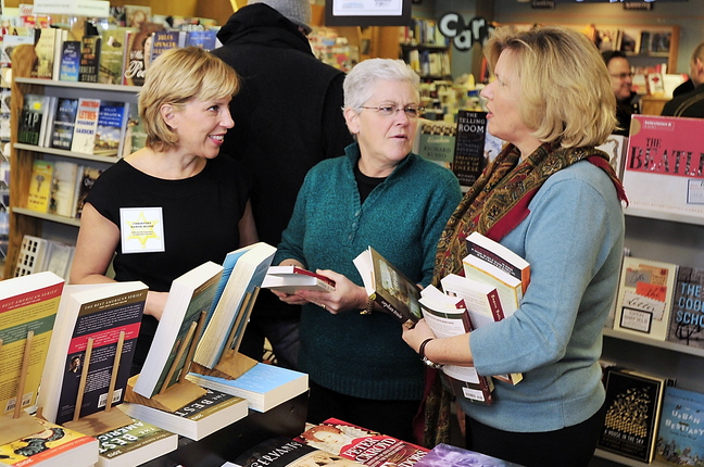 Jeanne Hulit, acting administrator of the Small Business Administration, right, and Gina McCarthy, administrator of the EPA, middle, chat with Christina Baker Kline, author of “Orphan Train,” at Longfellow Books in Portland on Small Business Saturday.