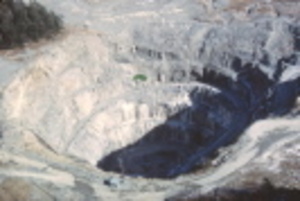 Photo from the 1970s shows the then-active Callahan Mining Corp. open pit in Brooksville. Maine’s most recent metal ore mine, now a federal Superfund site, has led to elevated levels of toxic heavy metals in the surrounding coastal estuary. The Board of Environmental Protection began its review Thursday of controversial changes proposed to Maine mining regulations.