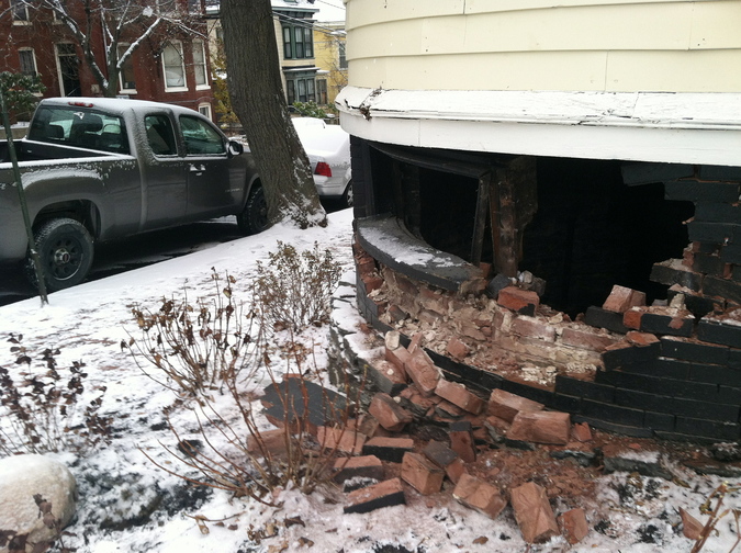 A car slid into a house at Mellen Street and Cumberland Avenue in Portland’s Parkside neighborhood, smashing a hole in the brick foundation, on Tuesday.