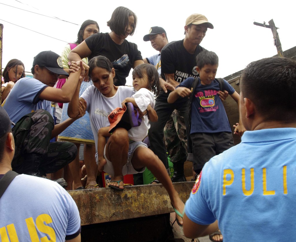 Residents in central Philippines are evacuated in anticipation of the powerful typhoon Haiyan.