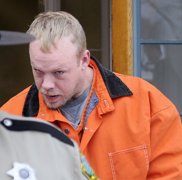 is escorted back to jail after his initial appearance Tuesday in Kennebec County Superior Court in Augusta on a charge of murdering Thomas Namer, whose body was discovered in Vassalboro on Friday.