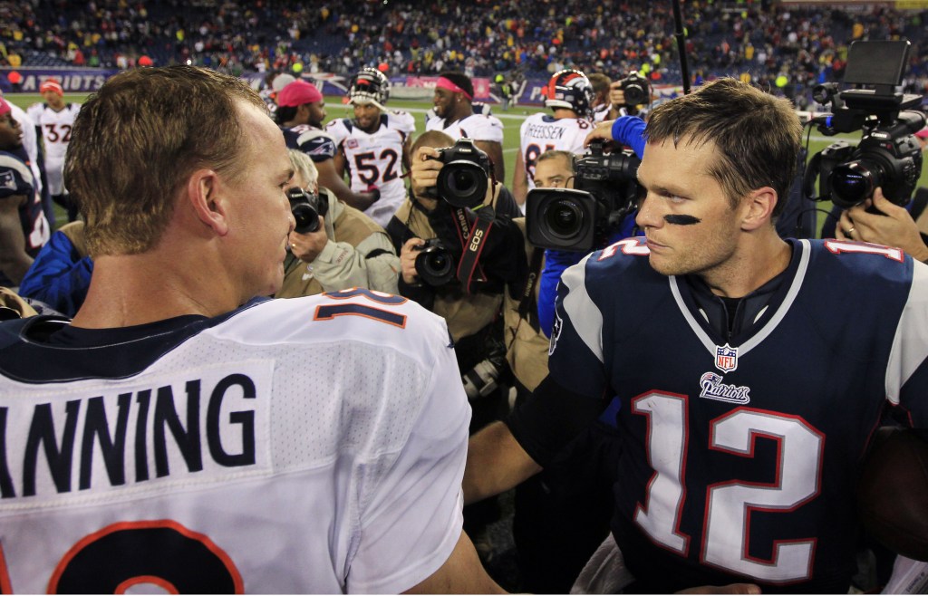 In this Oct. 7, 2012 file photo, Denver Broncos quarterback Peyton Manning, left, and New England Patriots quarterback Tom Brady meet after the Patriots’ 31-21 win in their NFL football game in Foxborough, Mass. (AP Photo/Steven Senne, File)