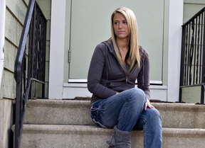 Isabelle Triezenberg, 21, sits outside a recovery home for drug addicts in Joliet, Ill. Triezenberg first tried heroin in 2011, and found it better suited to her budget than painkillers.