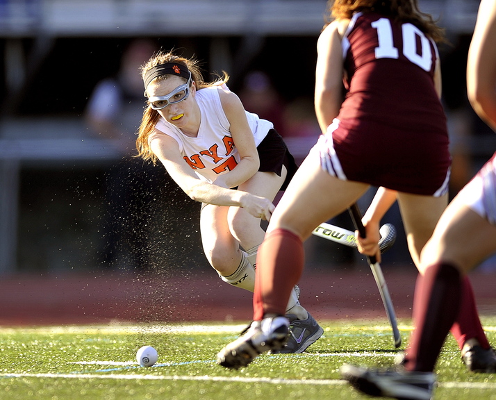 Gabe Souza/Staff Photographer NYA's Kayla Rose watches her shot go past Foxcroft's Aliviah King during first half action in the Class C field hockey championship at Yarmouth High School Saturday, November 2, 2013.