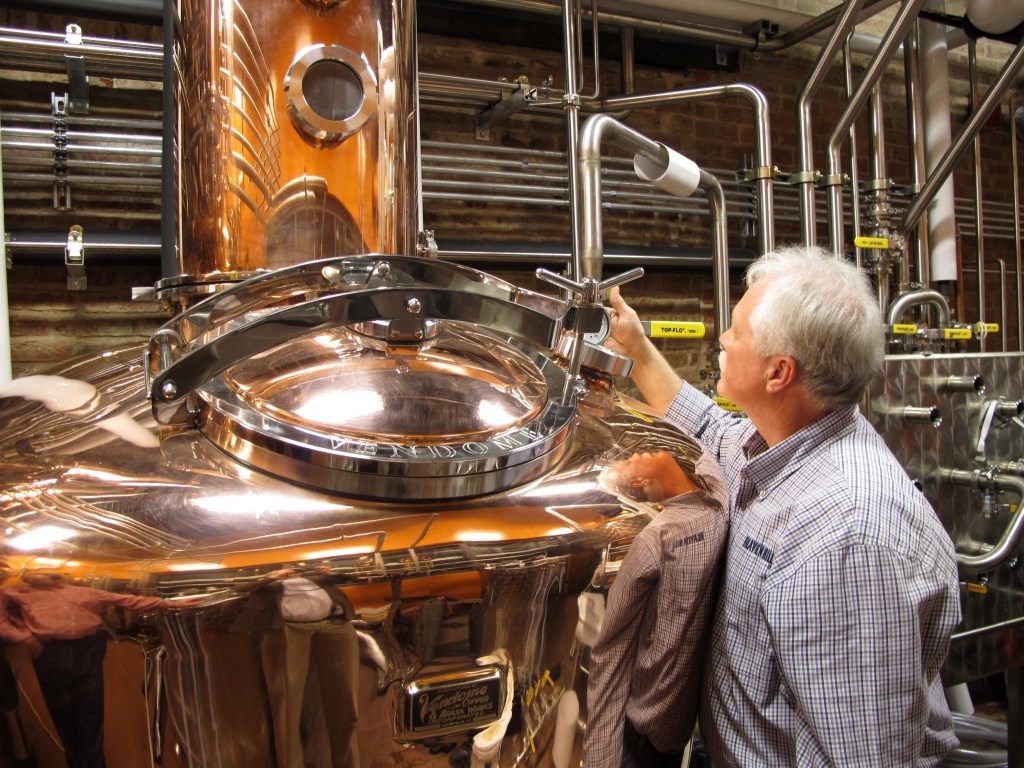 Charlie Downs, the artisanal craft distiller at a new Heaven Hill Distilleries tourism attraction in downtown Louisville, Ky., checks gauges on a still that will produce small batches of whiskey. The $10.5 million center, called the Evan Williams Bourbon Experience, is part of the Kentucky Bourbon Trail.