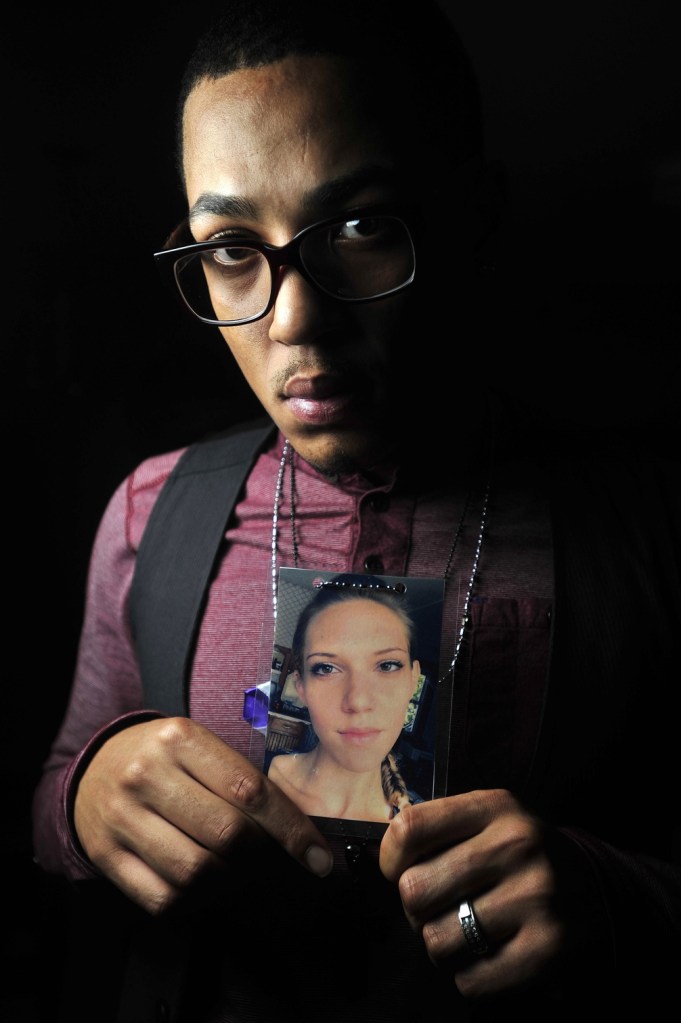 Tim Brown, 24, of Fairfield holds a photo of his friend Jillian Jones, who was stabbed to death Nov. 13 in Augusta. Brown started a Facebook page called the TEAL Project in her memory to raise awareness about domestic violence.