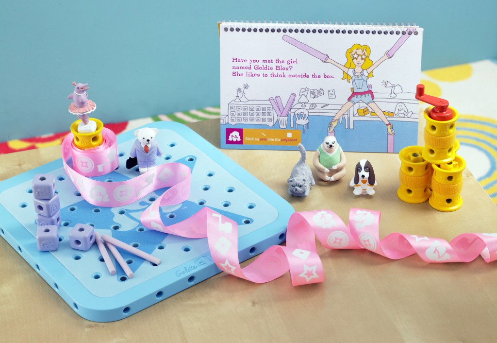 Toy items from “GoldieBlox and the Spinning Machine,” are shown in this 2012 photo. The toys are centered on is a female engineer named Goldie, and are designed to spark an interest by girls in science and engineering. The Oakland, Calif.-based toy company that is a finalist for a Super Bowl ad contest is suing the Beastie Boys over an online video spoof of the group’s song, “Girls.” Goldieblox says it is suing the popular hip hop group in response to threats of copyright infringement from the group.