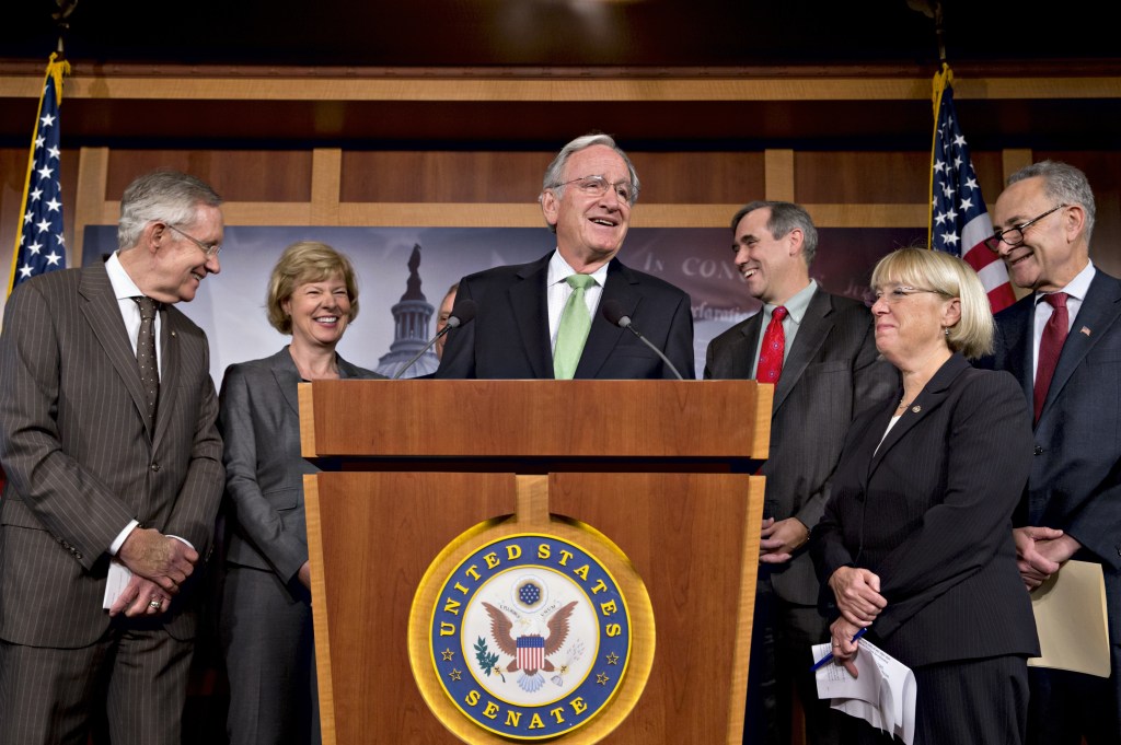 There were smiles all around as Democrats gathered after the Senate cut off debate to move toward a historic vote on legislation outlawing workplace discrimination against gay, bisexual and transgender Americans, on Capitol Hill in Washington on Thursday. From left are Senate Majority Leader Harry Reid, D-Nev., Sen. Tammy Baldwin, D-Wis., Sen. Tom Harkin, D-Iowa, Sen. Jeff Merkley, D-Ore., Sen. Patty Murray, D-Wash., Sen. Charles Schumer, D-N.Y.