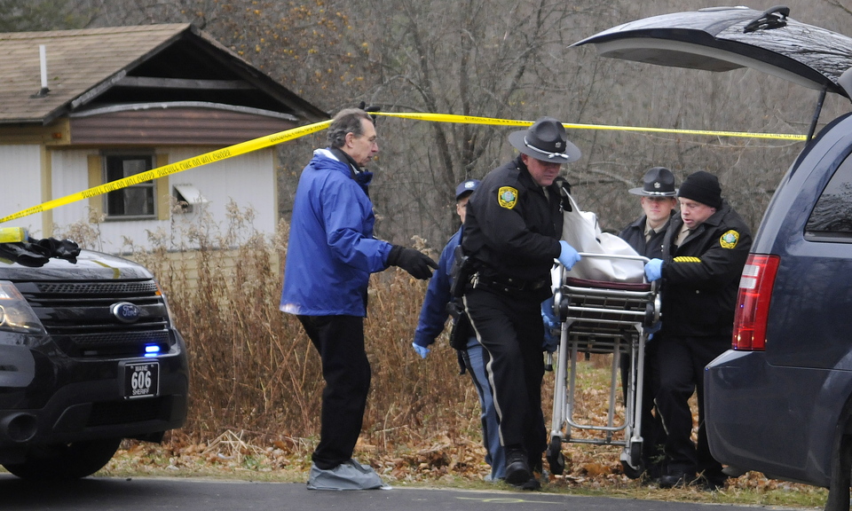 Police move the body of Thomas Namer on Friday to a medical examiner’s van in Vassalboro.