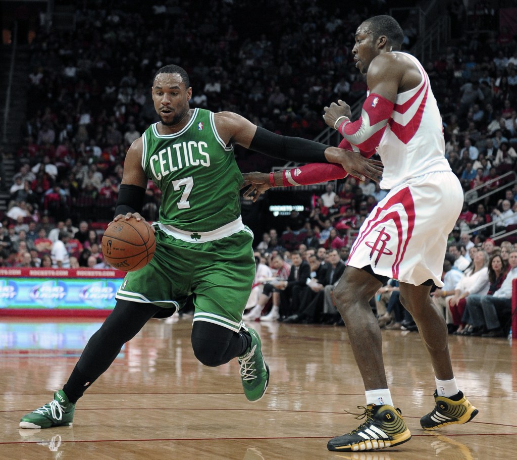 Boston’s Jared Sullinger drives around Houston’s Dwight Howard during the Rockets’ 109-85 win at home Tuesday. Sullinger had 10 points off the bench for the Celtics.