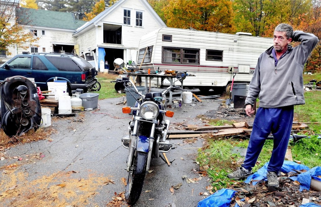 FINES: Fines against Wilton homeowner Duane Pollis are piling up. Town officials say the home, numerous vehicles and piles of salvaged building materials violates a town ordinance and is imposing fines of $100 per day until the home is compliance.