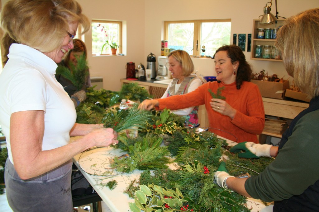 Wreath makers at a workshop at Lincoln Farm Studio in Falmouth get creative with greens, pods, cones and berries.
