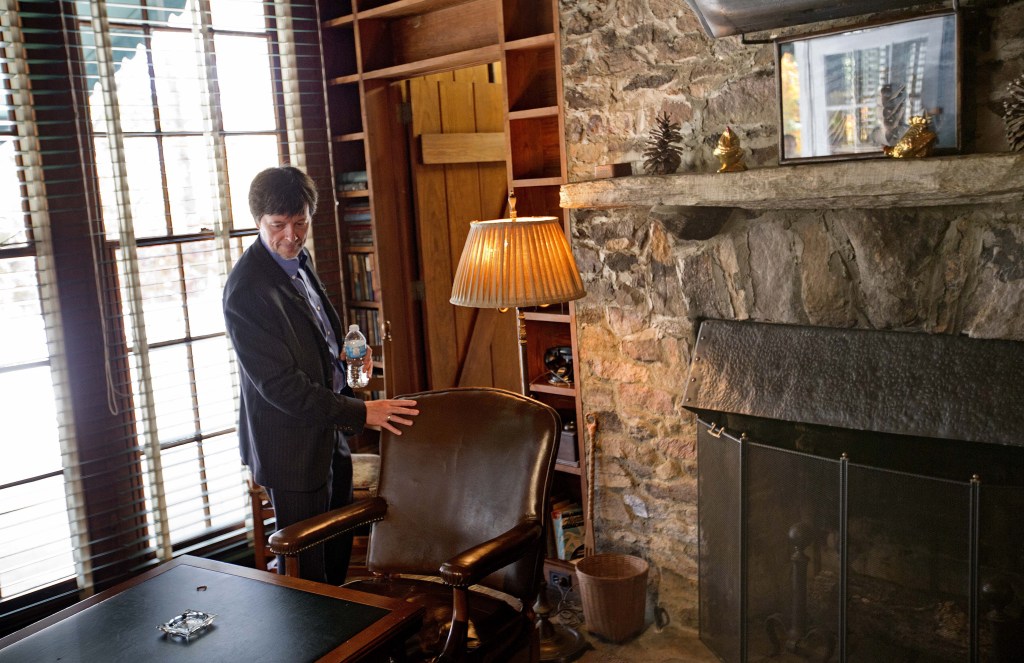 Documentary filmmaker Ken Burns, right, touches the chair where former President Franklin D. Roosevelt was sitting for a portrait when he died April 12, 1945 in his Georgia home, Saturday, Nov. 2, 2013, in Warm Springs, Ga. Burns along with several members of the Roosevelt family toured the home known as the Little White House Saturday used by Roosevelt as Burns previewed parts of his 14-hour film on the Roosevelt’s.