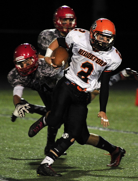 Biddeford's Corey Creeger breaks tackles to gain considerable yardage. Scarborough hosted Biddeford in Western Division A playoff football action Friday.