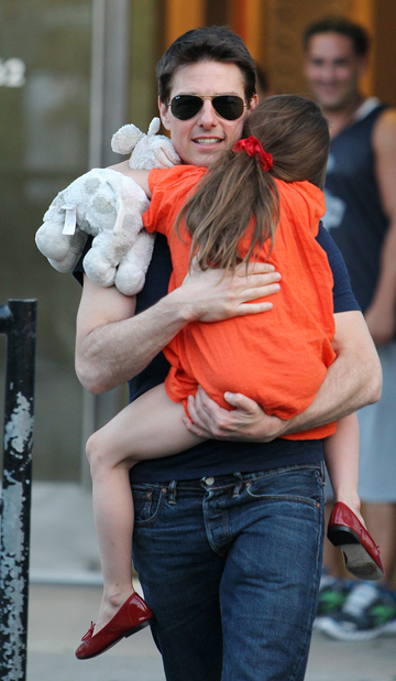 Tom Cruise, shown embracing his daughter, Suri Cruise, last July in New York, objects to criticism oft his parenting.