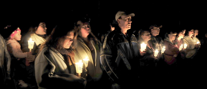 Staff photo by David Leaming TRIBUTE: Close to 150 family and friends attended a candlelight vigil for Jillian Jones in Bingham where she grew up on Sunday, Nov. 17, 2013. Jones was killed last week in Augusta. People remembered Jones, comforted each other and listened to music that she liked.