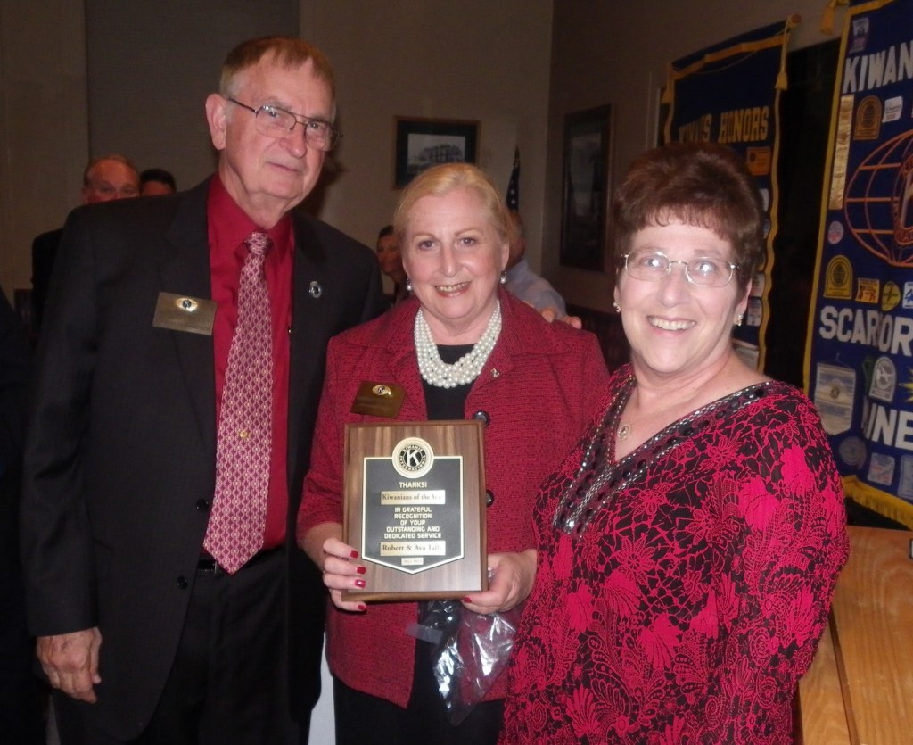 Outgoing Scarborough Kiwanis Club president Annalee Rosenblatt, center, awards Robert Talley and Ava Adams-Talley with the Kiwanian of the Year award for their contributions to the community.