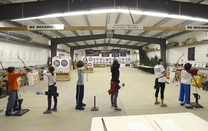 Students take aim during class at Lakeside Archery. The students, ages 10 to 14, are involved in Junior Olympic Archery Development, and some compete in New England tournaments.