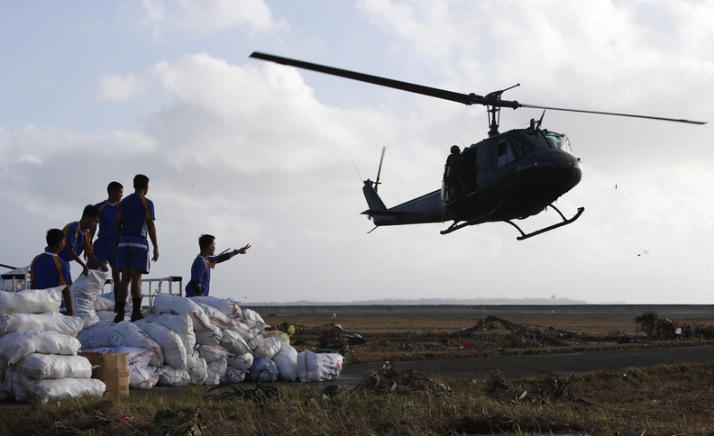 A military helicopter prepares to land to airlift relief supplies for typhoon victims, in Tacloban city, central Philippines.