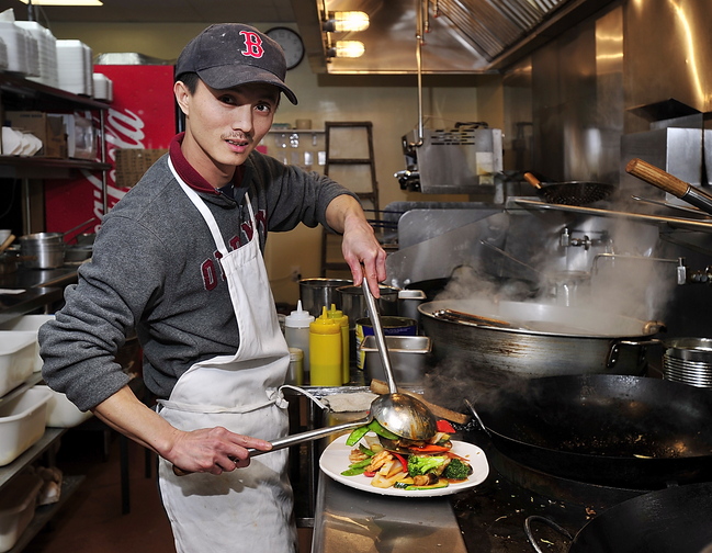 Chef Hai Huang makes Jumbo Shrimp with Mixed Vegetables at Evergreen Chinese Restaurant.