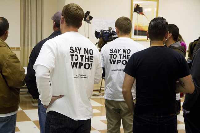 Members of the Working Waterfront Coalition, supporters of Say No to the WPO, gather at the campaign headquarters at the Maine Military Museum in South Portland.