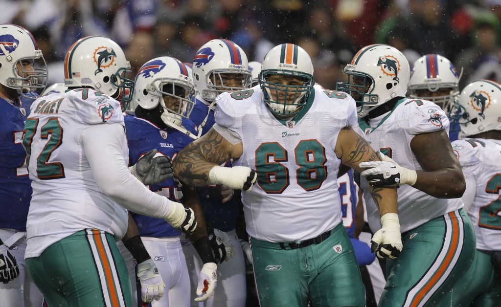 In this Dec. 8, 2011, file photo, Miami Dolphins’ Richie Incognito, 68, is penalized as he elbows a Buffalo Bills player during a game at Orchard Park, N.Y.