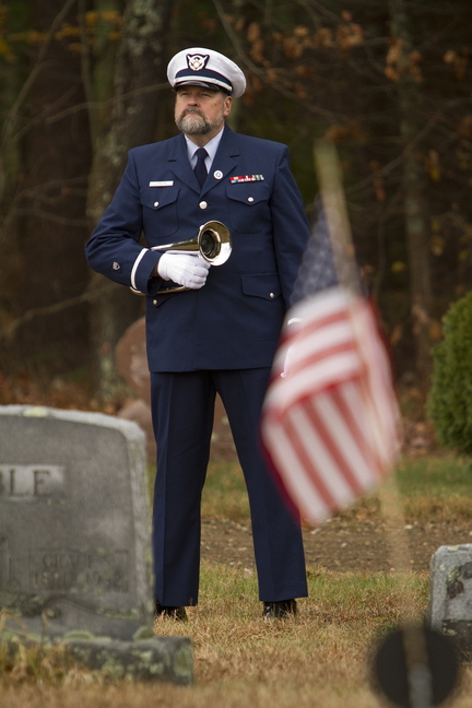 Ensign Harold Jamieson, a Coast Guard bugler, stands by during the second annual Veterans Day observance at Pine Grove Cemetery in West Kennebunk on Sunday.