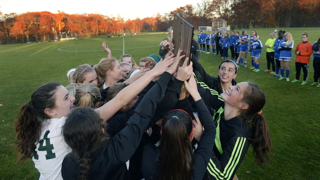 Waynflete celebrates with the trophy after winning the Western Class C title, and will be looking for another trophy Saturday when it meets Orono in the state final at Hampden.