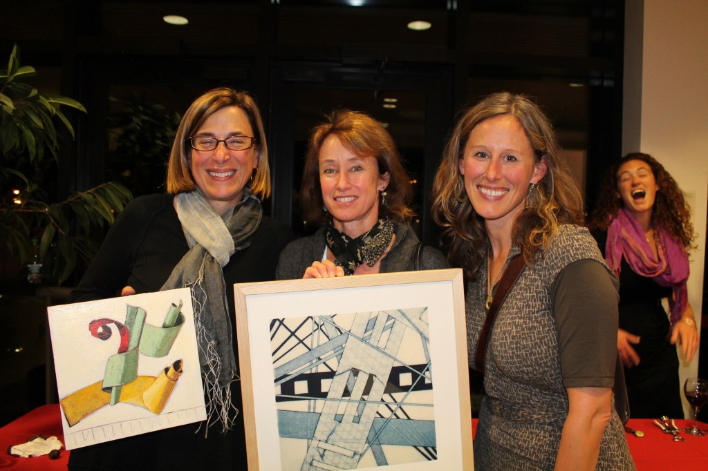 Artists Chris Beneman of Portland, Liz Armstrong of Yarmouth and Dietlind Vander Schaaf of Portland, proudly display their newly acquired original artwork.