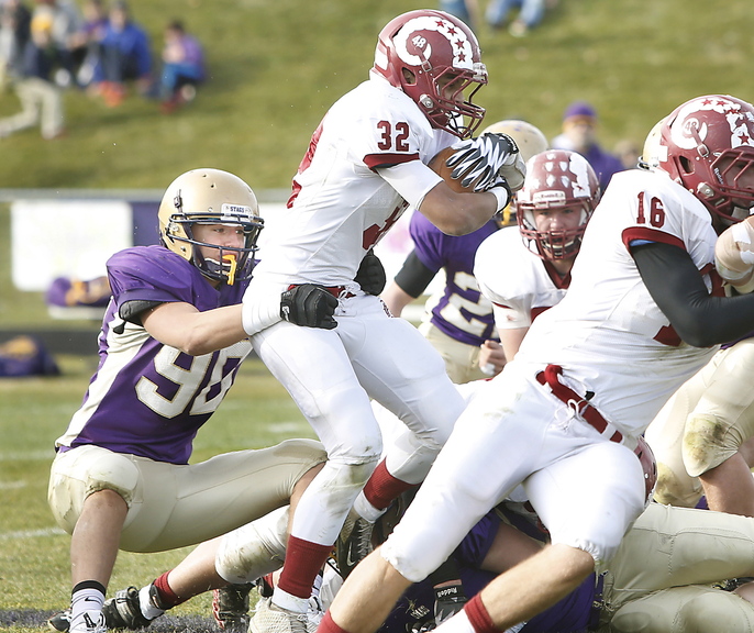 Zordan Holman of Cheverus slows Dane Johnson of Bangor during Cheverus’ 37-0 victory Saturday in an Eastern Class A semifinal. The Stags will meet Portland in the final.