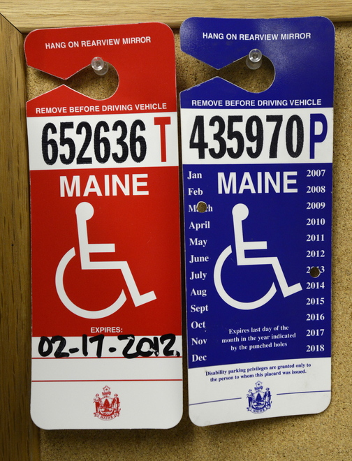 Examples of placards that parking officer Andy Martin looks for as he patrols the Old Port looking for illegal handicapped parking.