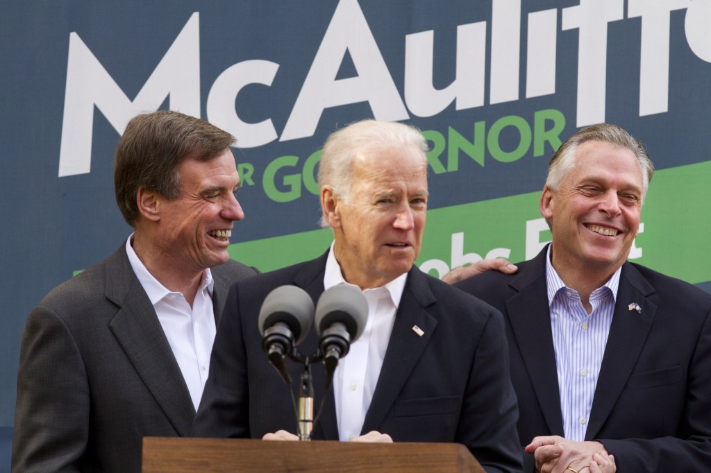 Vice President Joe Biden, center, accompanied by Sen. Mark Warner, D-Va., left, speaks at a campaign event for Virginia Democratic gubernatorial candidate Terry McAuliffe, right, on Monday in Annandale, Va. On Tuesday, Virginia voters go to the polls to choose between McAuliffe and Ken Cuccinelli for the next governor.