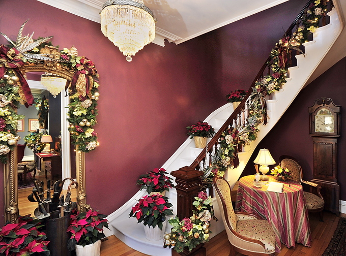 This staircase and hall mirror are the work of Dan Kennedy in the 1876 home that he owns with John Hatcher. Five Victorian-era homes were decked out for Christmas to raise money for Gary’s House, a local nonprofit.